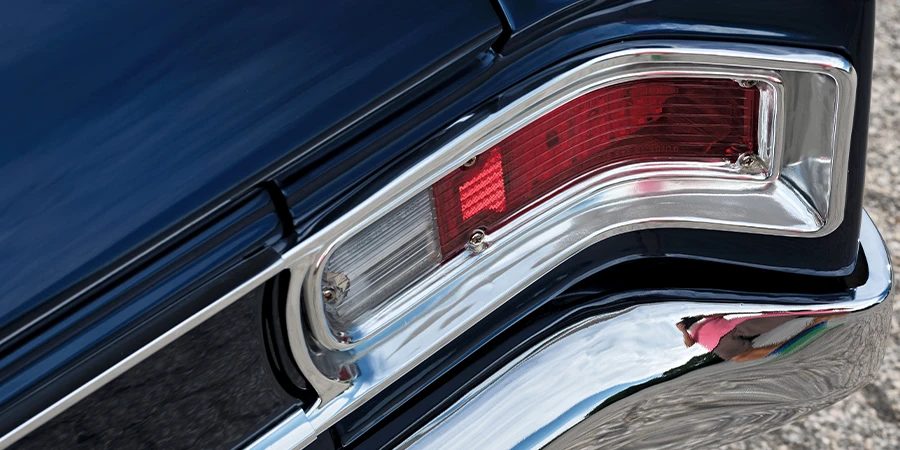 1966 Chevy Chevelle rear tail light assembly, chrome trim, and polished bumper details