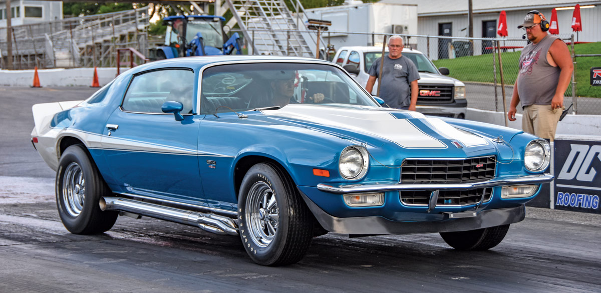 1972 Chevy Camaro Z28 at drag strip with side pipes and blue paint