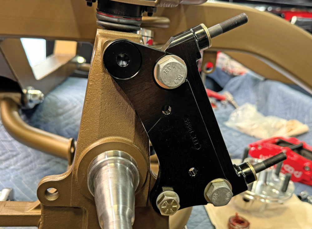 assembling the suspension and caliper mounting bracket on the 1972 Chevrolet Nova's front chassis