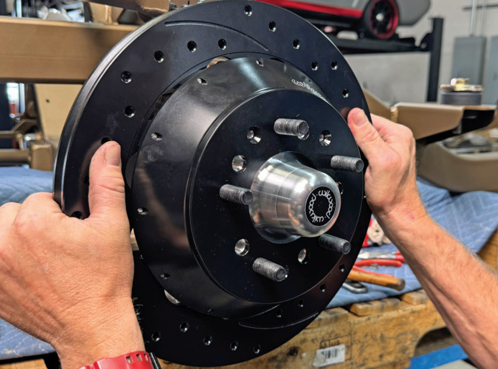 finalizing rotor and hub installation on the 1972 Chevrolet Nova's front suspension system