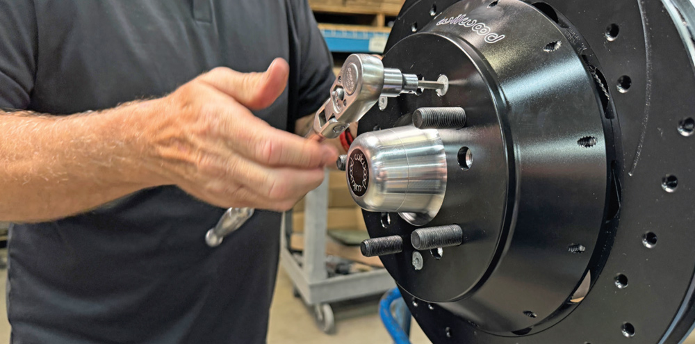 torqueing Wilwood brake hub bolts on a 1972 Chevrolet Nova for secure fitment
