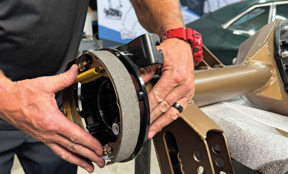 positioning rear drum shoe assembly during brake upgrade on the 1972 Chevrolet Nova