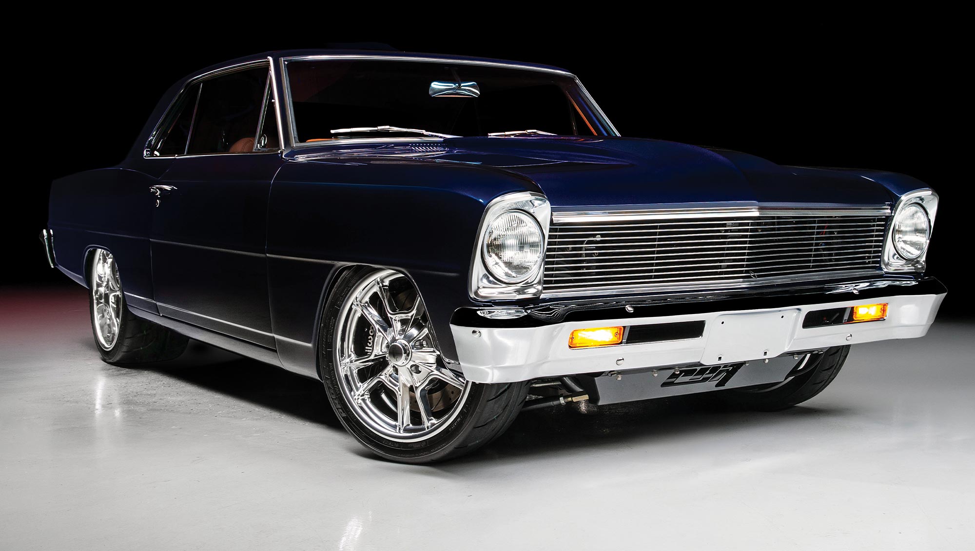 1966 Chevy Nova, deep blue paint, chrome grille, polished wheels, and modern custom upgrades