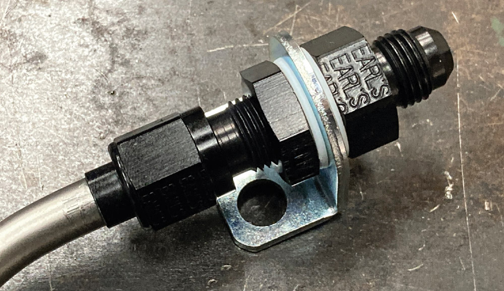Earl's Performance AN fitting securely mounted to the fuel line bracket