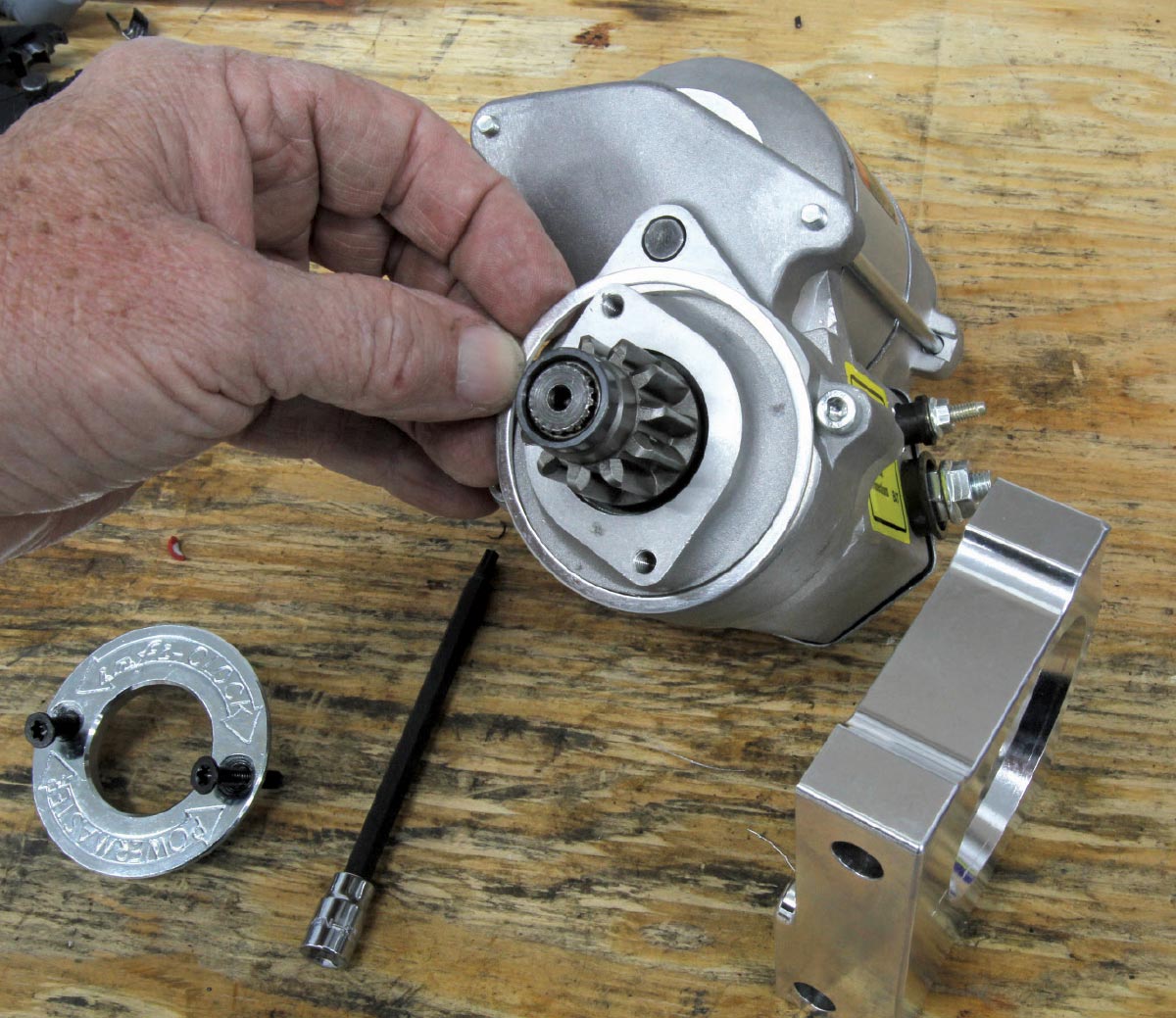 Inspecting the starter drive gear for proper setup and operation