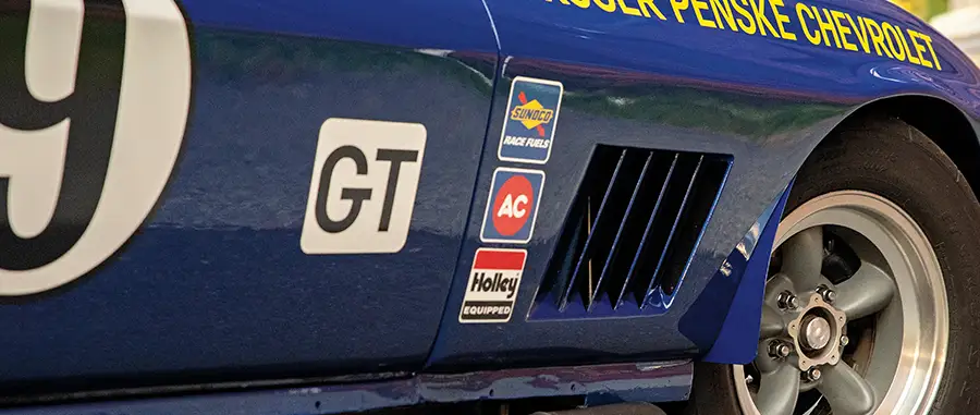 1966 Chevrolet Corvette, close-up of racing decals, Roger Penske Chevrolet graphics, and GT class branding