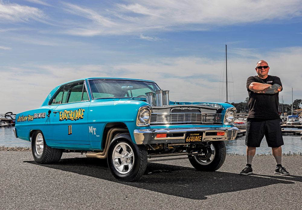 1966 Chevy Nova Gasser in turquoise Earthquake II livery with raised front suspension and polished velocity stacks at marina