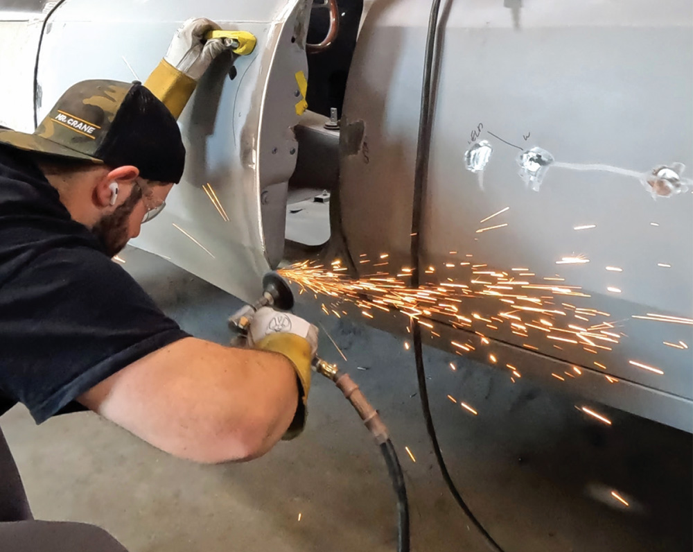 technician grinding and refining door welds on the Chevelle