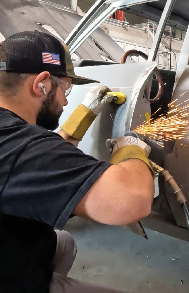 smoothed door edge welds visible, showing precise alignment work