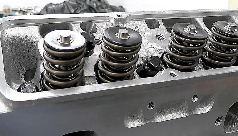 Close-up of installed valve springs and retainers on the aluminum cylinder head