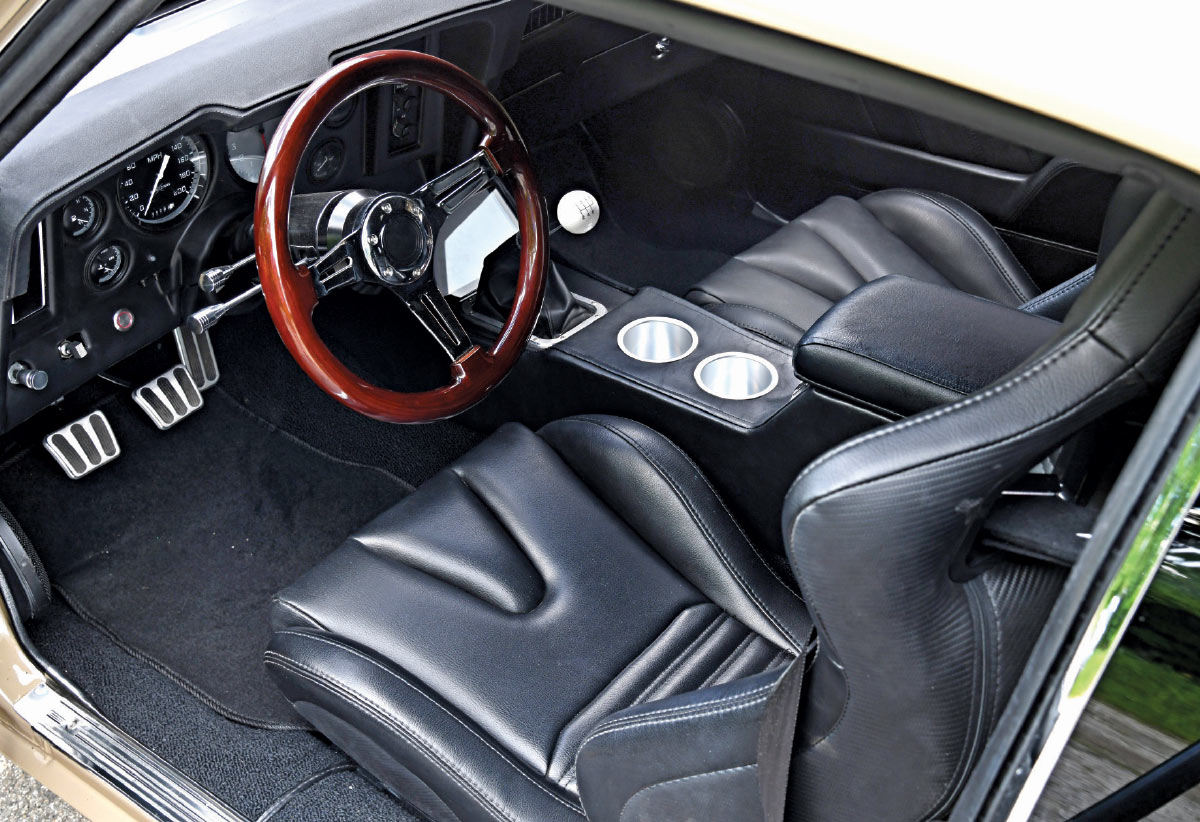 1969 Camaro interior black leather seats woodgrain steering wheel modernized cockpit