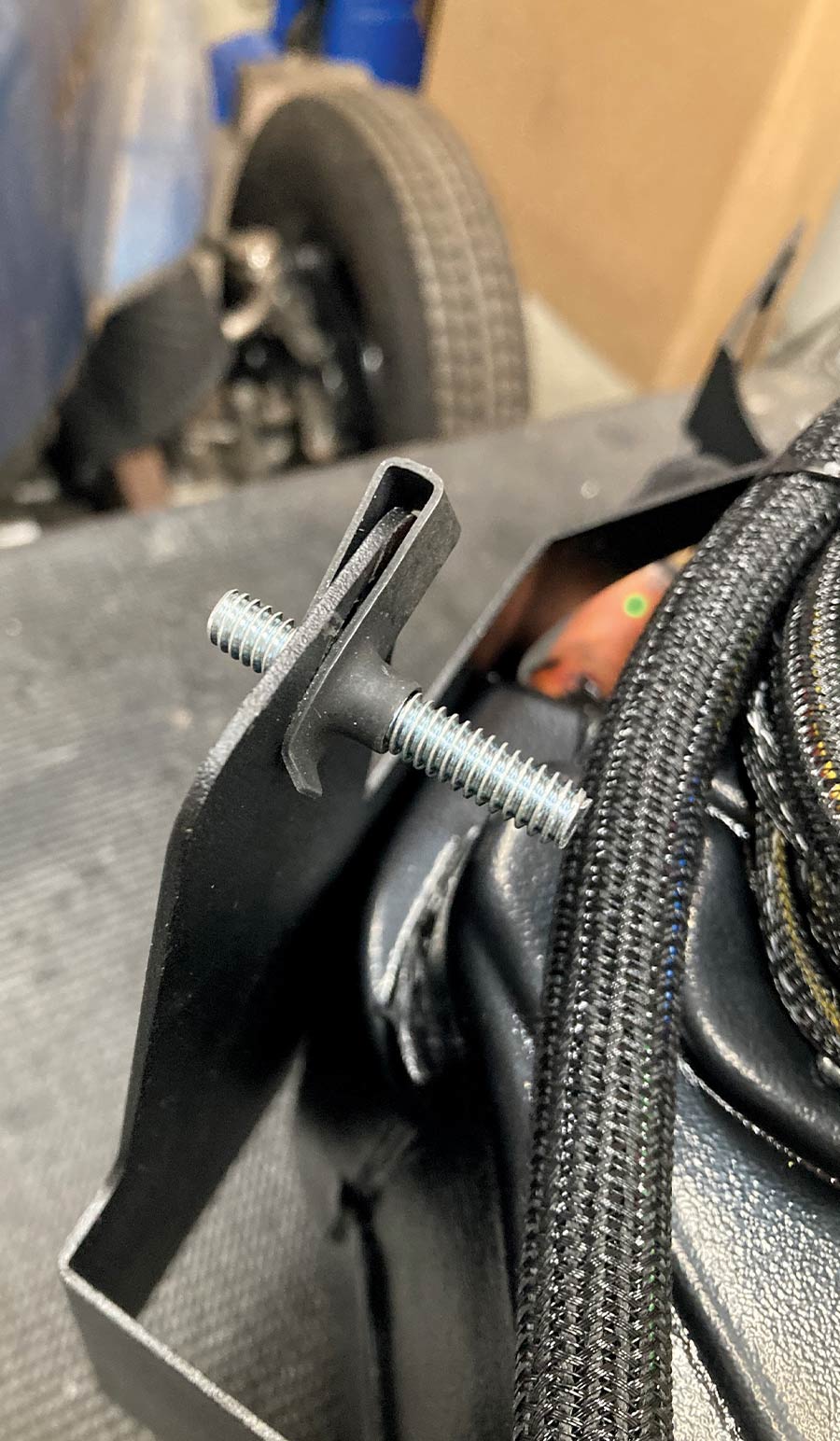 Fastening a mounting bracket to the Vintage Air evaporator housing