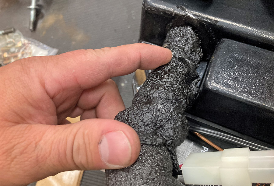 Sealing an AC hose connection with insulating foam wrap