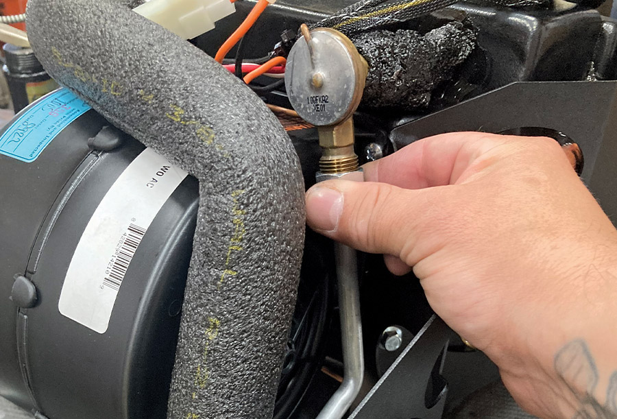 Positioning refrigerant lines and expansion valve on the AC evaporator