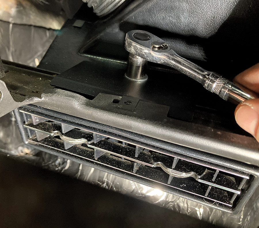 Securing the lower AC vent with a ratchet under the dash