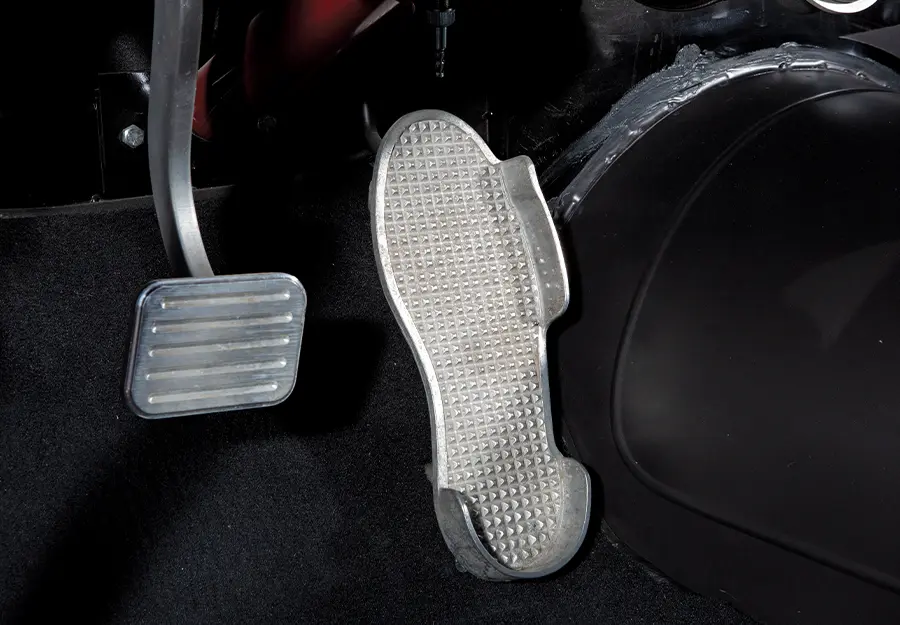 1957 Chevrolet Bel Air gas pedal featuring a custom foot-shaped accelerator and aluminum brake pedal for vintage race-inspired style