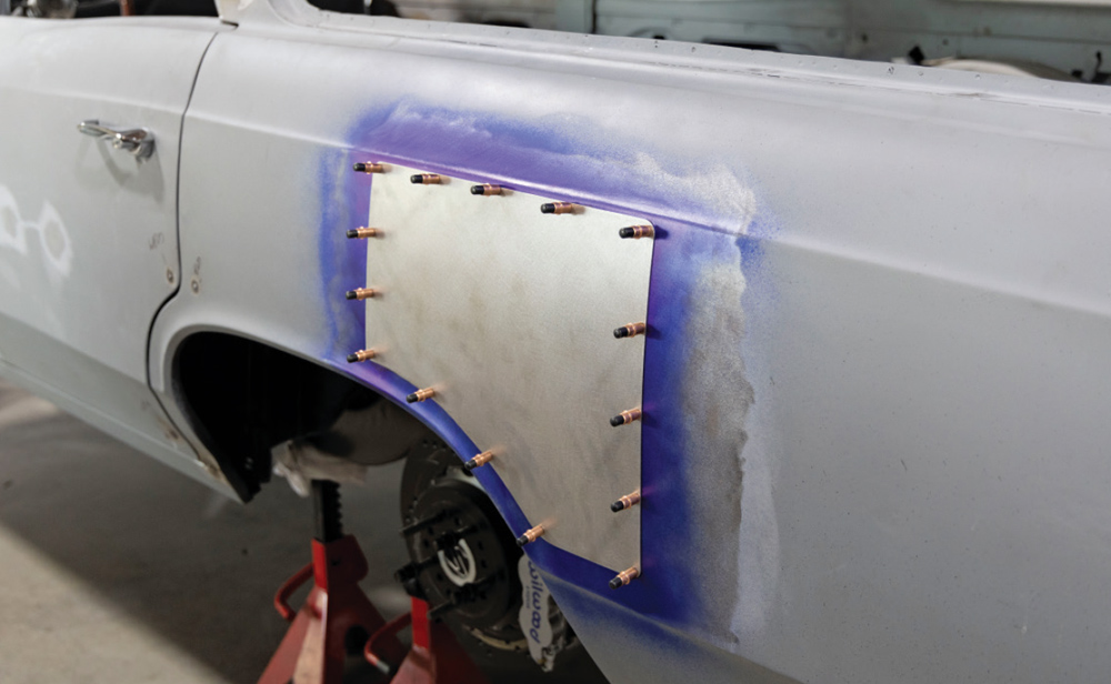patch panel is fully secured with Cleco pins, ready for final welding and blending into the body