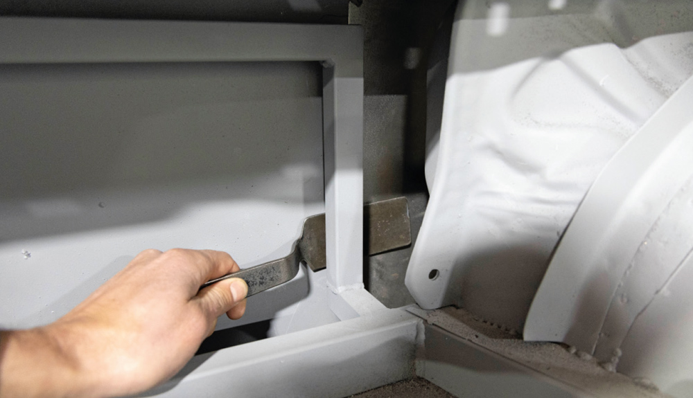 interior bracing is adjusted to support the newly installed patch panel for structural integrity