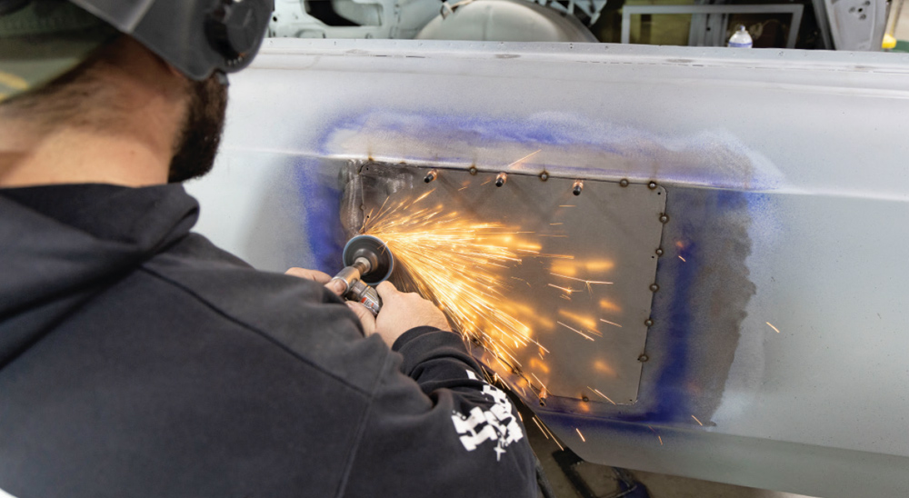 final grinding process smooths out the welds, completing the fuel door delete modification