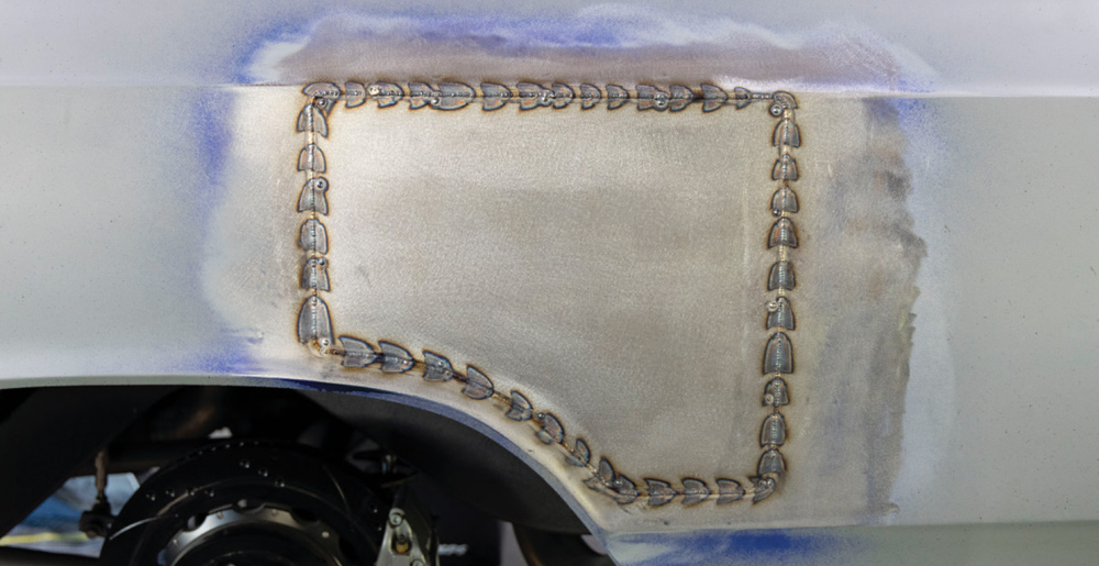 completed welds outline the patch panel, securing it firmly in place for a smooth bodywork finish