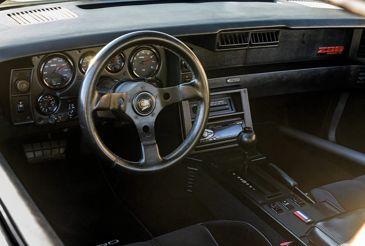 1986 Camaro IROC-Z cockpit featuring Grant GT steering wheel and Holley EFI digital gauges