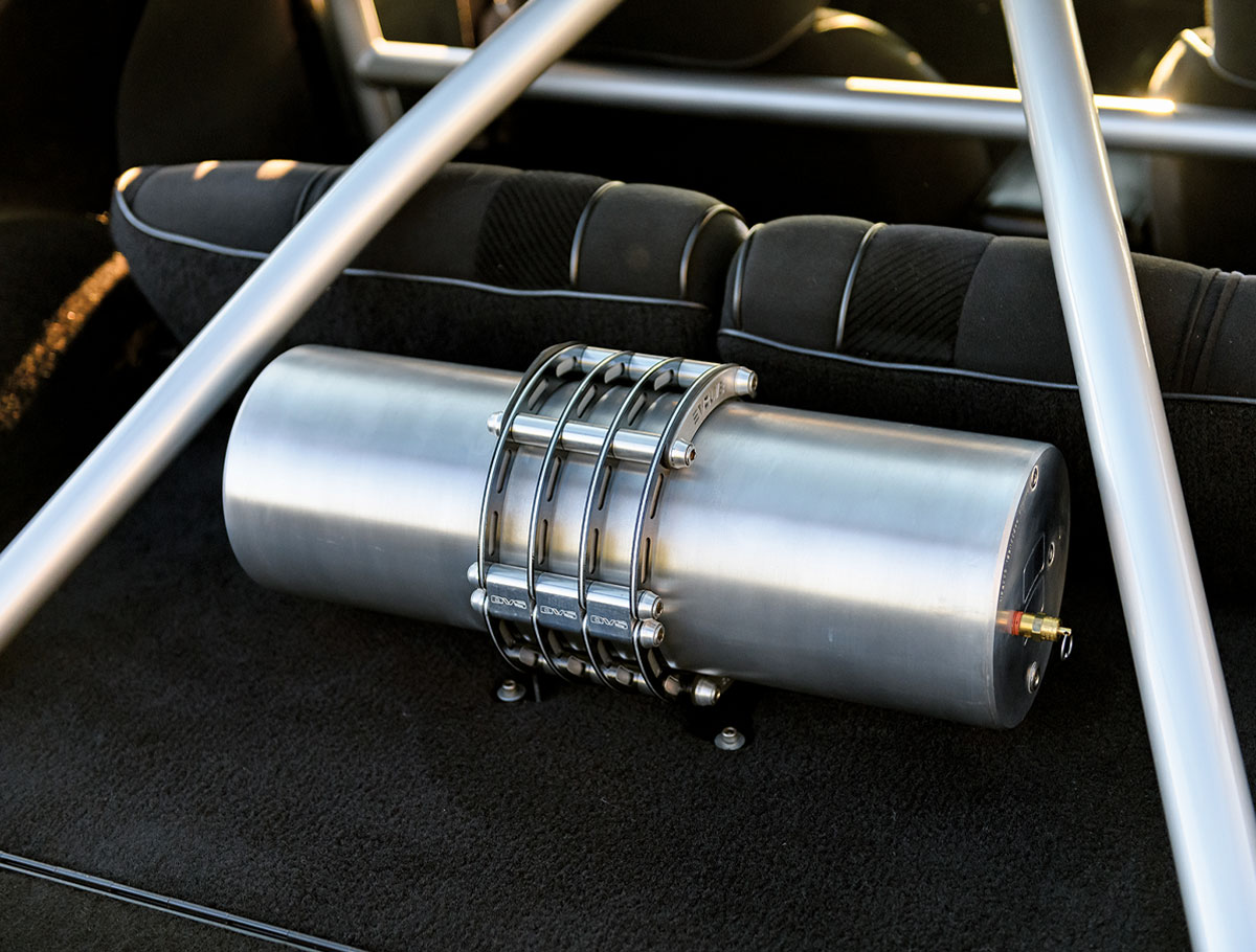 1986 Camaro IROC-Z rear compartment features a polished air tank with custom mounting brackets
