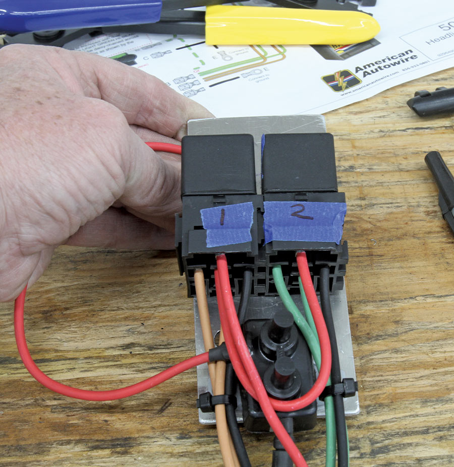 American Autowire headlight relay assembly with labeled relays for installation