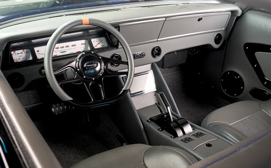 1966 Chevy Nova modern interior with a leather-wrapped dash and digital gauges