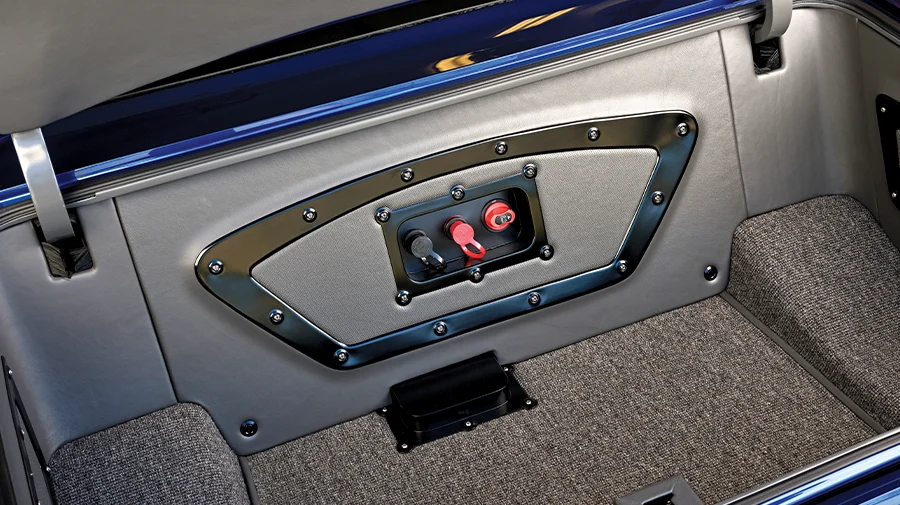 1966 Chevy Nova fully customized trunk interior with a battery disconnect switch panel