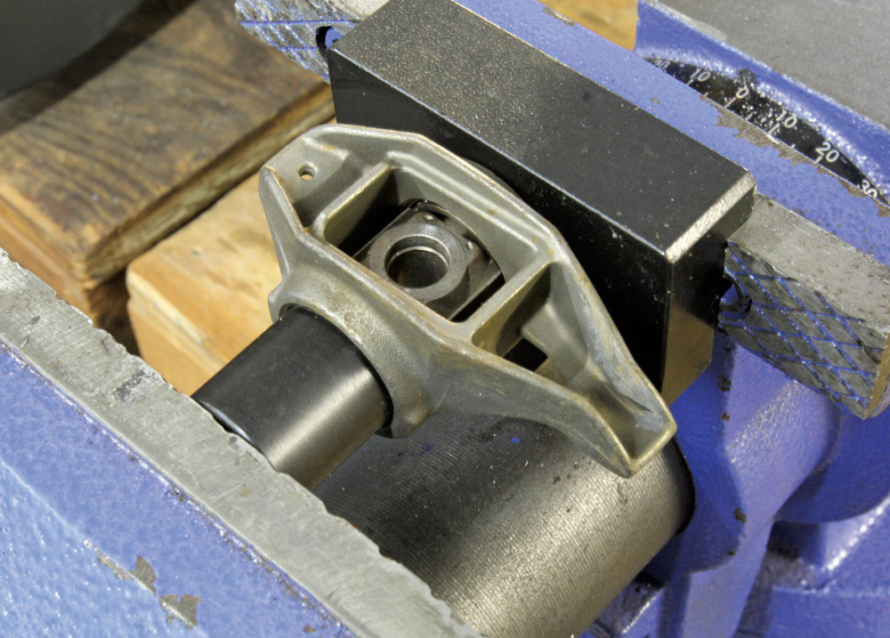Factory GM LS rocker arm on shaft setup being examined, found in Gen IIIIV V8 platforms from early 2000s