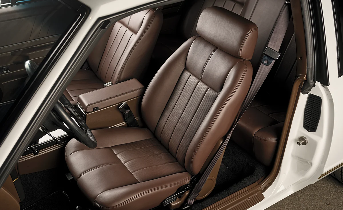 1987 Monte Carlo upgraded interior bucket seats with brown stitching and factory seatbelt mounts