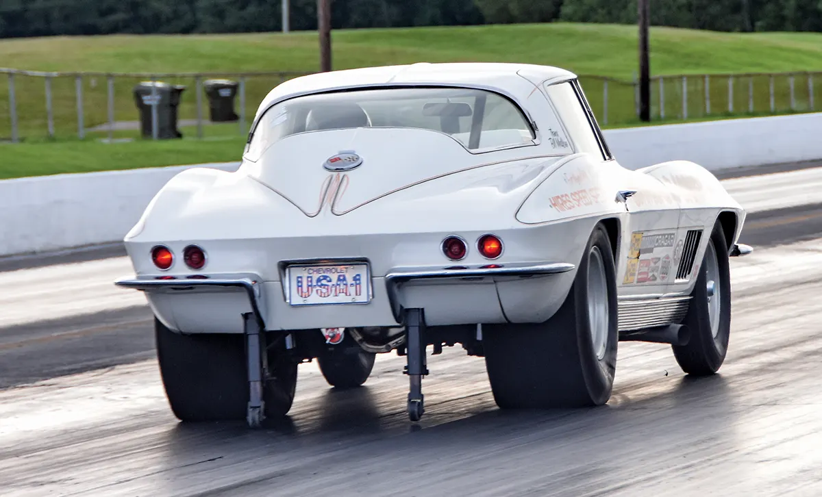Launch shot of 1963 Corvette showing USA-1 plate and rear suspension setup for quarter-mile runs