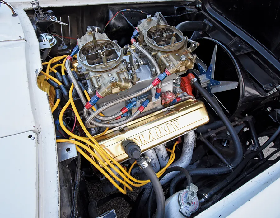 Big-block Chevy with dual Holley carburetors and gold Shadow valve covers powering the '63 drag build