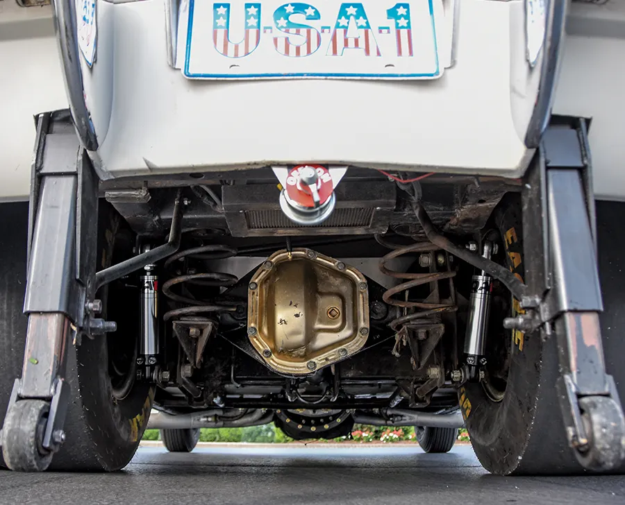 Rear axle and suspension of 1963 Corvette with wheelie bars, adjustable coilovers, and Goodyear slicks