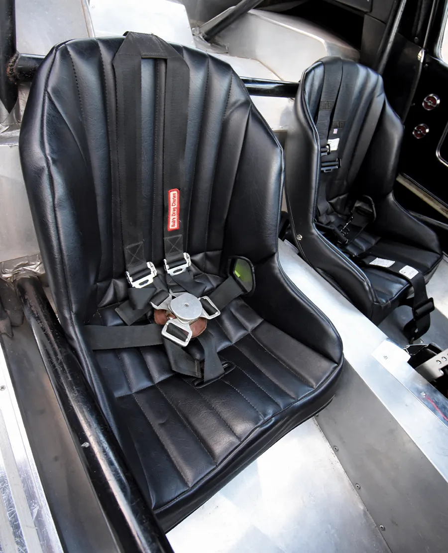 Racing bucket seats with Simpson harnesses and aluminum interior in '63 split-window Corvette