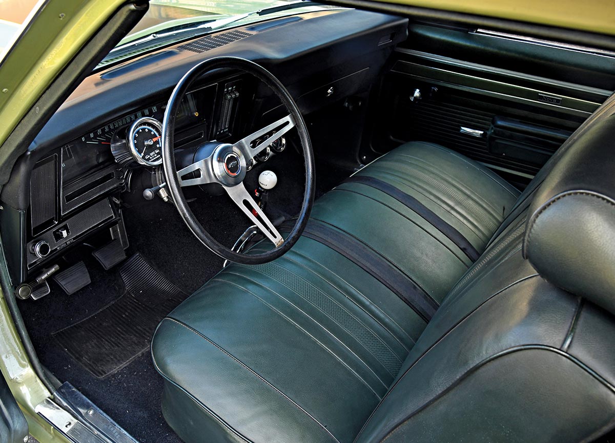 1969 Nova green bench seat interior Sunpro tach Hurst shifter