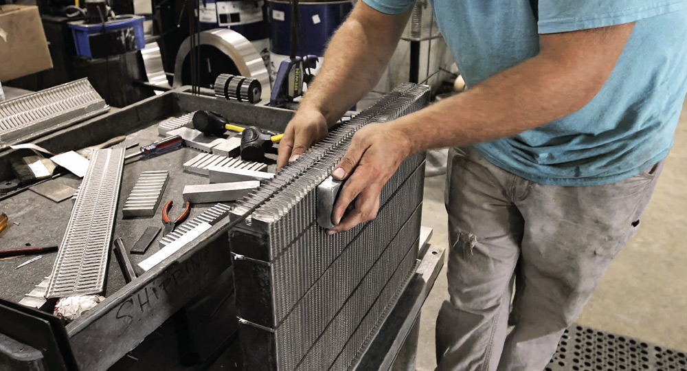 close-up of aluminum radiator core construction with extruded cooling tubes