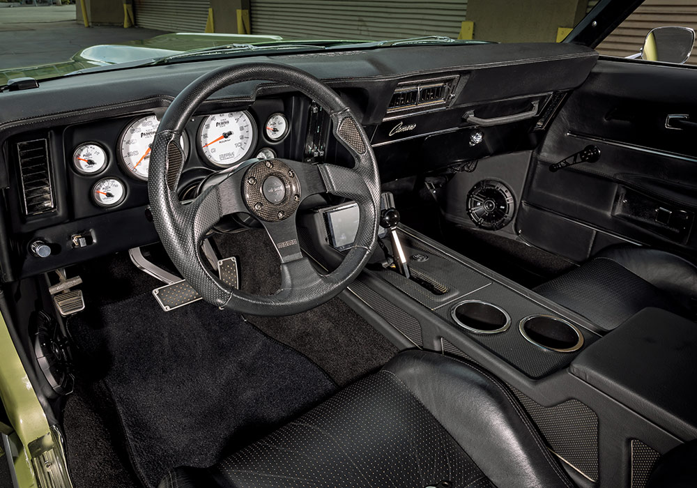 1969 Chevrolet Camaro SS interior featuring custom black leather seats and carbon-fiber accents