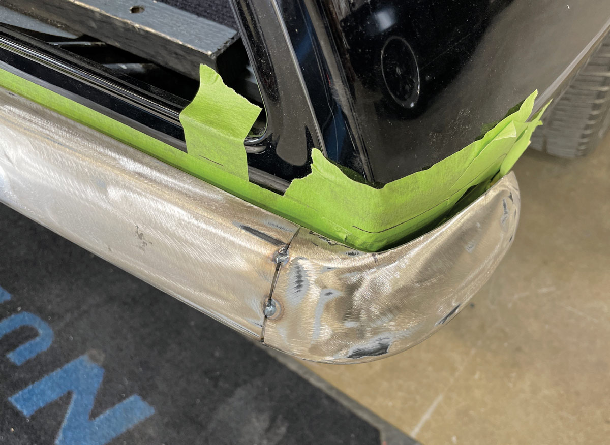 1969 Camaro rear bumper corner tack-welded and metal-finished for seamless body line integration