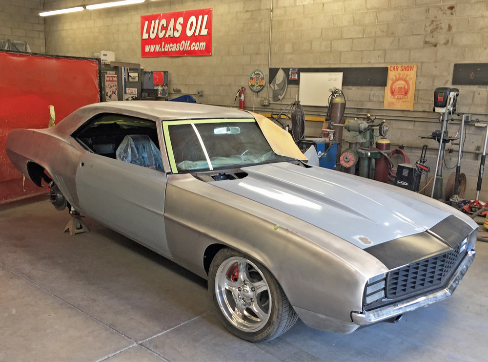 1969 Camaro in bare metal with mocked-up body panels and custom wheels awaiting fitment