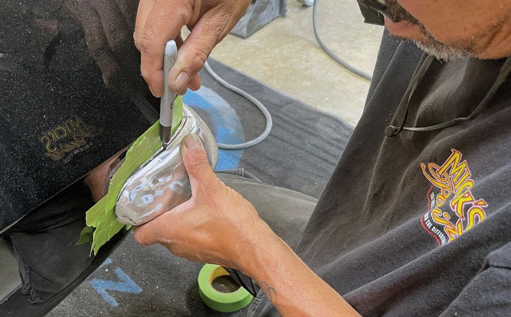 1969 Camaro bumper corner marked for cutting to improve custom fit against rear quarter