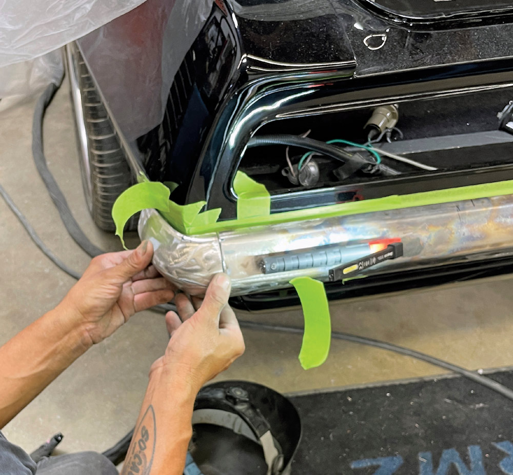 1969 Camaro bumper corner precisely positioned before tack welding to the main bumper