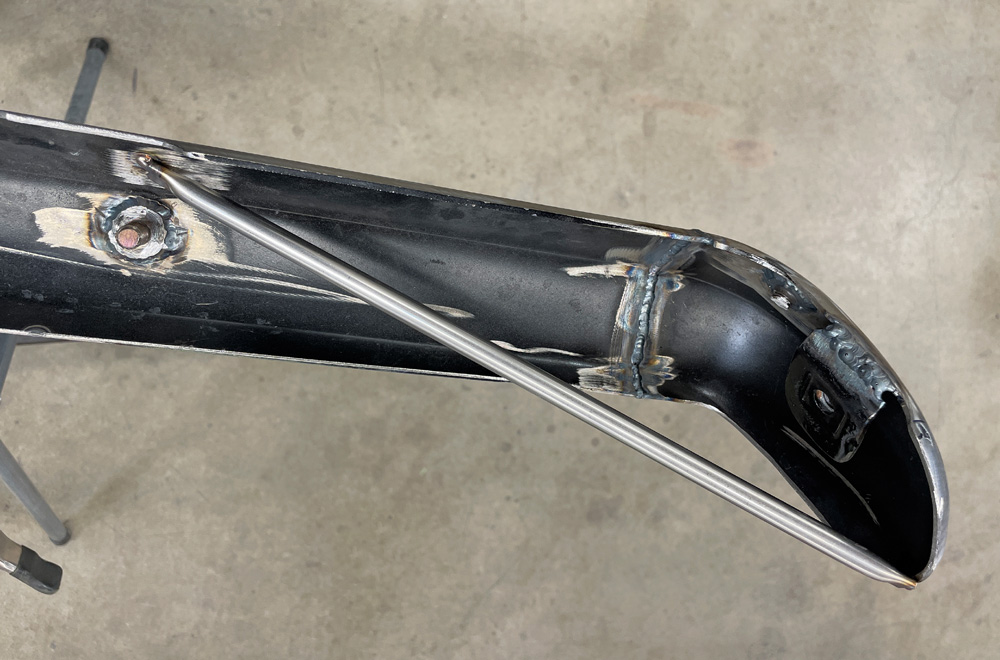 1969 Camaro bumper reinforced with custom-fitted internal bracing rod for added strength