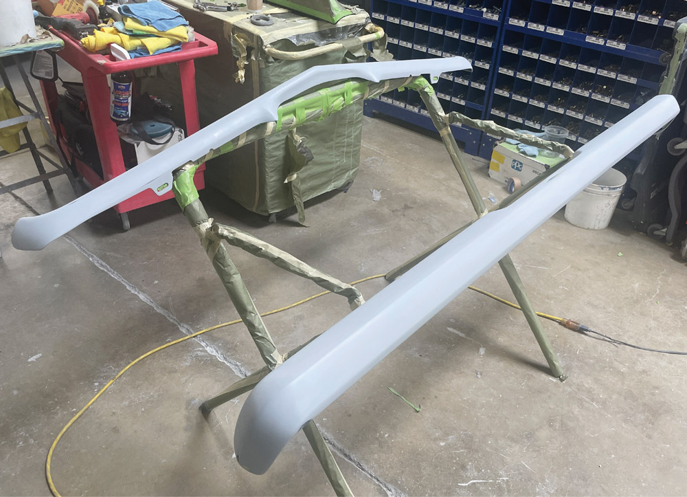 1969 Camaro bumpers in primer surfacer, final-prepped for paint and installation