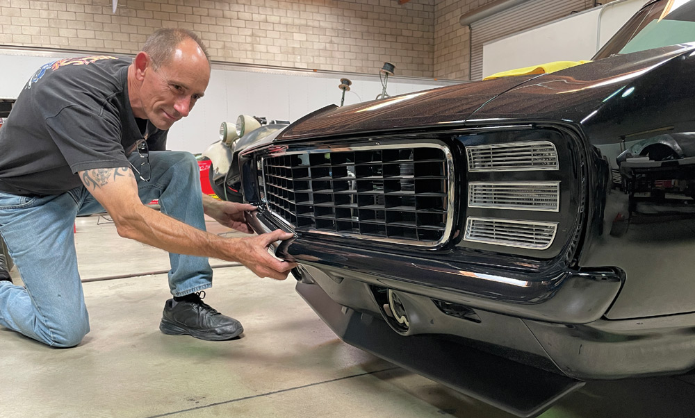 1969 Camaro bumper fitment finalized by hand for precision alignment to the lower fascia