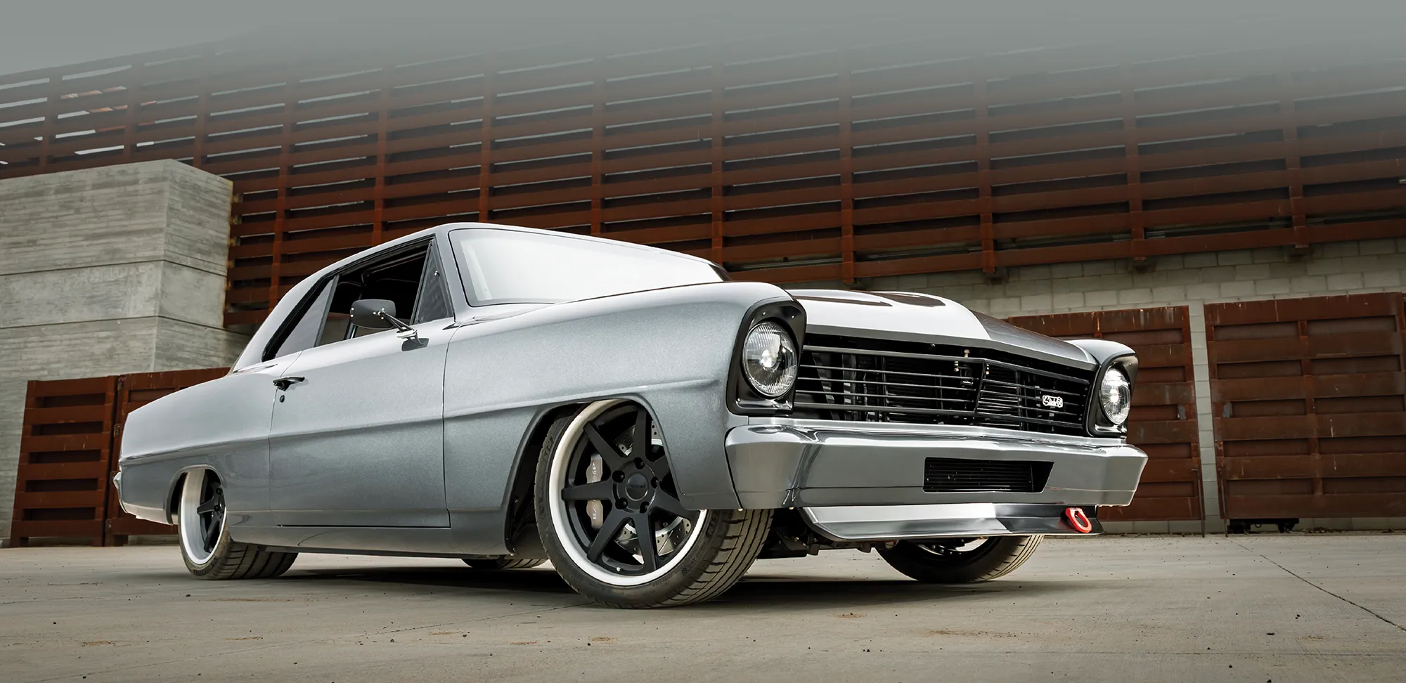 1966 Chevy Nova with front splitter, drag hooks, and Restomod detailing