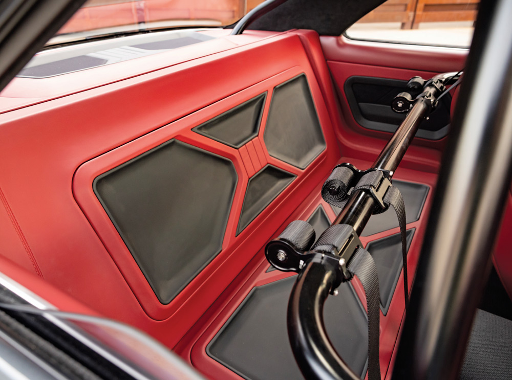 1966 Chevy Nova rear seat delete panel with integrated harness bar setup