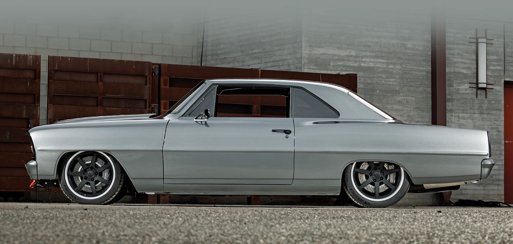1966 Chevy Nova side profile shows staggered wheels and tucked ride height