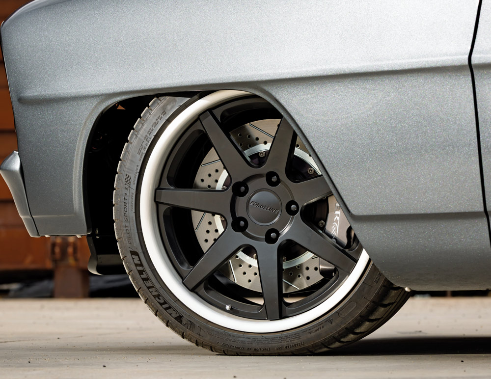 1966 Chevy Nova Forgeline wheels, Michelin tires, and Baer brakes behind deep dish lips