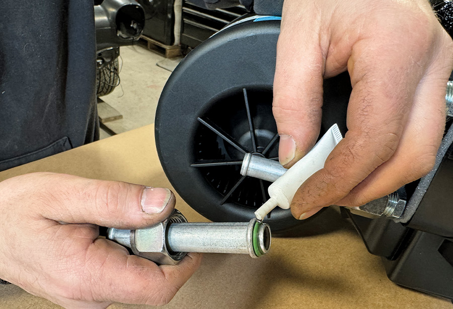 Prepare the upper and lower heater hard lines by first properly seating and lubricating the #10 O-rings with provided refrigerant oil